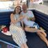 a couple drinking champagne on the pool deck of a cruise ship