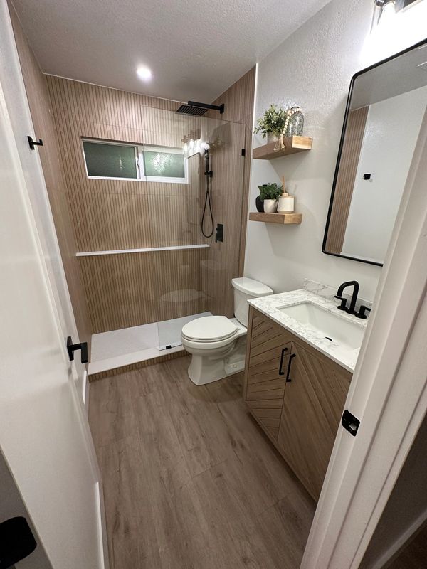 modern reeded tile in Canyon lake,CA by justice renovations. Black fixtures in guest bathroom. 