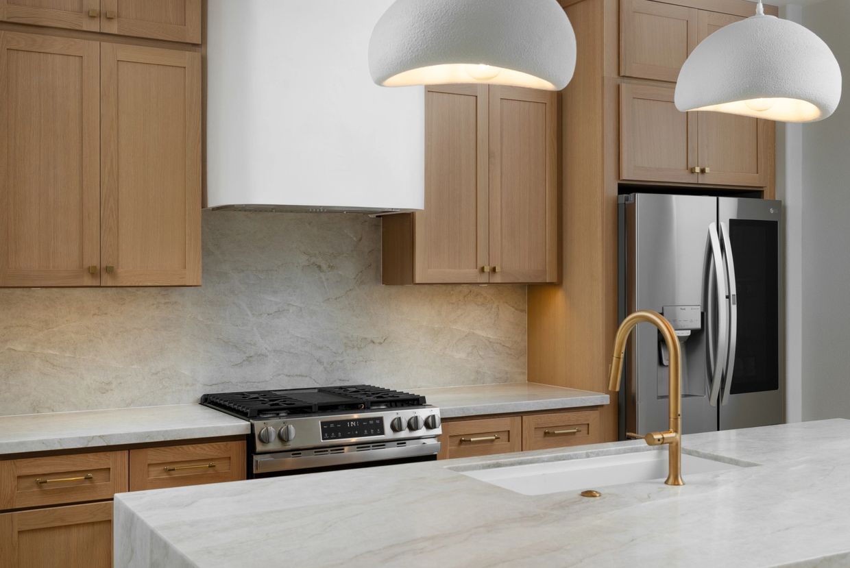 Custom curved Venetian plaster hood range built by Justice Renovations