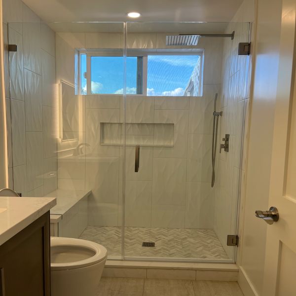 Walk in shower with textured tile in canyon  lake CA.Guest bathroom renovation by Justice Renovation