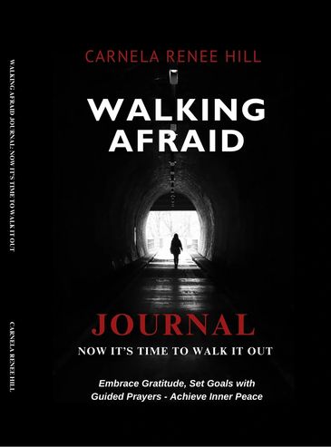 A person walks alone through a dark tunnel towards the light, symbolizing overcoming fear.