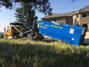 hook truck in action lifting a 20 yard roll off container for house, business, garage, cleanouts
