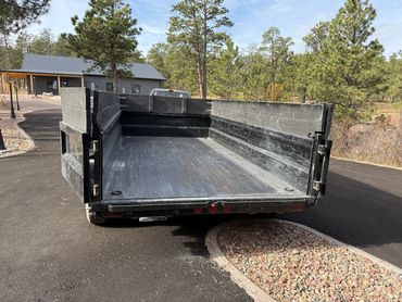 Our affordable 11 yard dump trailer. We also have affordable roll off cans for bigger projects.