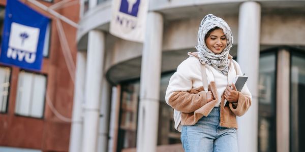 High school senior walking out of NIU campus