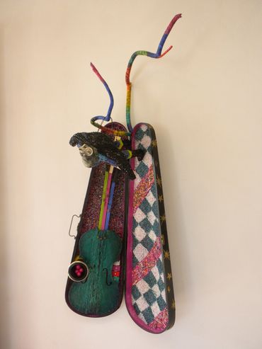 Ceramic bird head on painted  doll body, violin case covered in seed beads with wood branch, violin 