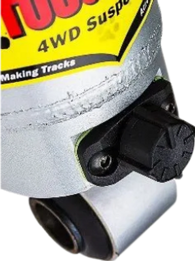 Close-up of a Tough Dog 4WD suspension component with adjustment knob.
