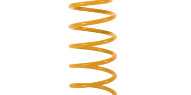 Bright yellow metal coil spring isolated on white background.