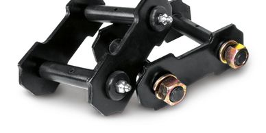 Black metal shackle with bolts and grease fittings.
