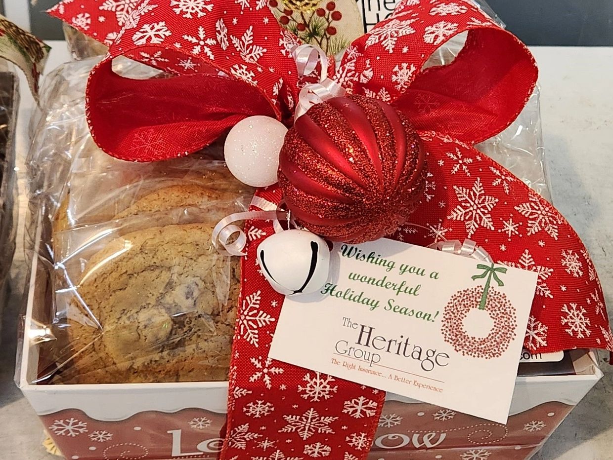 Cookie gift basket with decorative snowflake bow and bell.