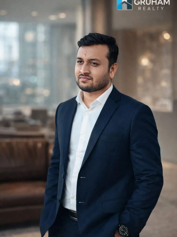 Professional man in a business suit with Gruham Realty logo.