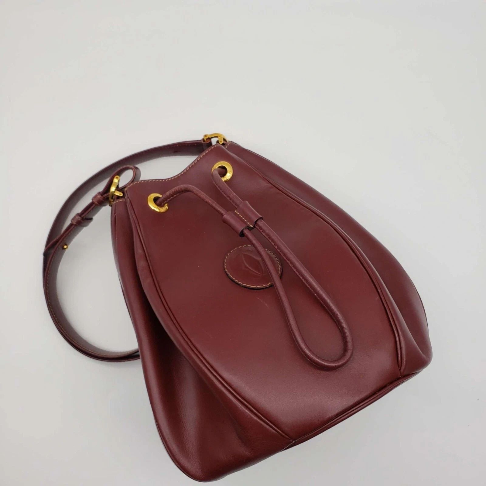 Cartier Burgundy Leather Bucket Bag Drawstring Crossbody — photo 5