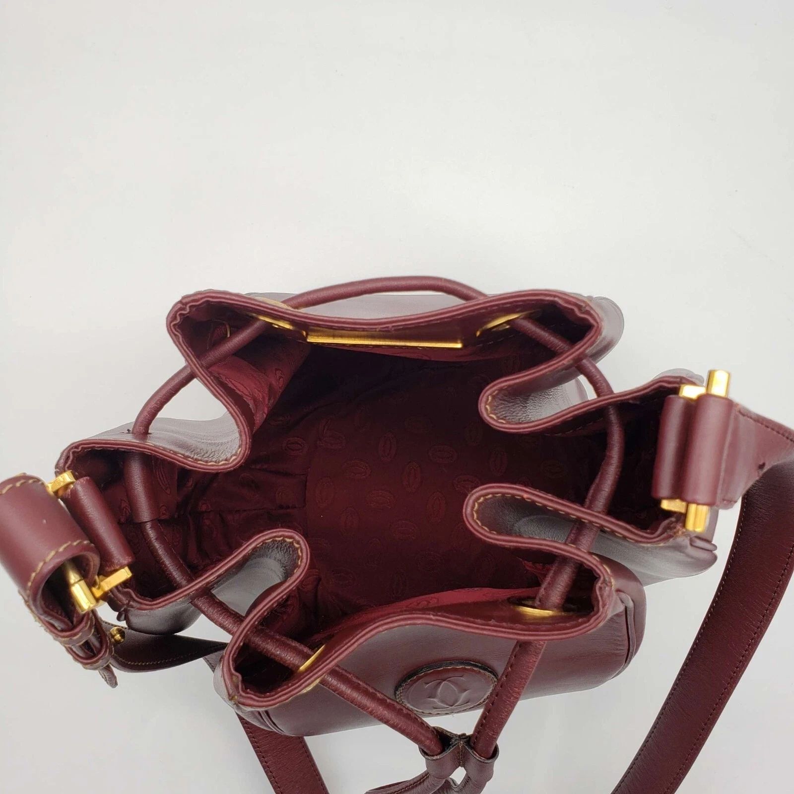 Cartier Burgundy Leather Bucket Bag Drawstring Crossbody — photo 7
