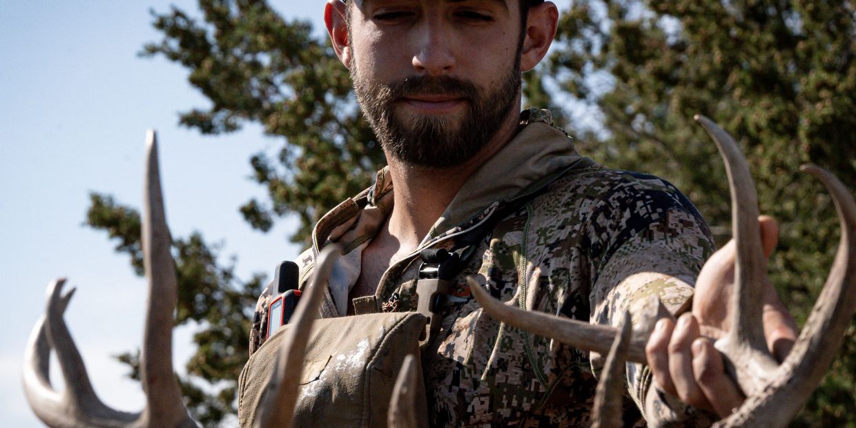 A man walking on the Whitetail Hunting 