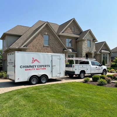 Chimney Experts truck and trailer at a Louisville Kentucky home for chimney repair, cleaning service