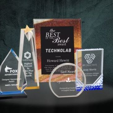 Laser engraved acrylics and real wood plaques.  Ask us about our economy line too.