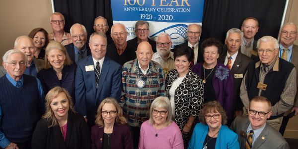 Group photo at a 100-year anniversary celebration event.