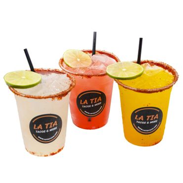 Three colorful cocktails with lime garnishes from La Tia Tacos &amp; More.