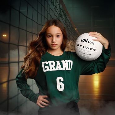 Young volleyball player posing confidently with a ball by the net.