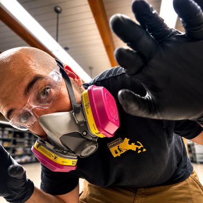 Floor Cleaning guy wearing a respirator 