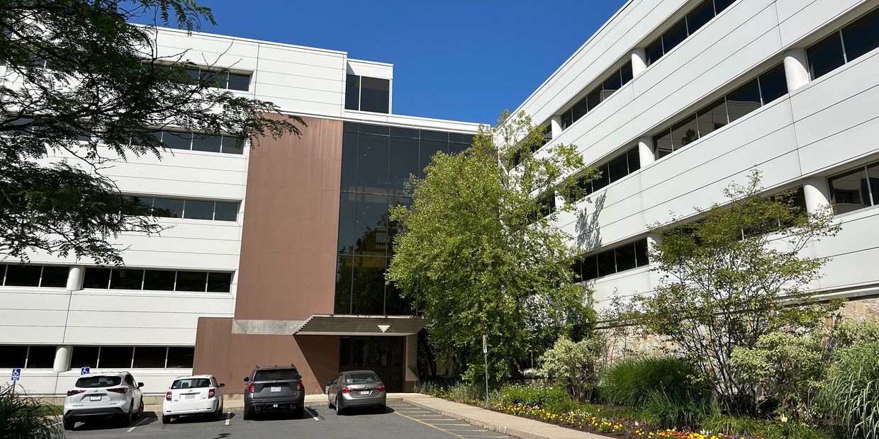 large beautiful medical office building with cars parked out front