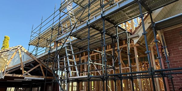 Scaffolding around a building under construction.