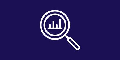 Magnifying glass icon focusing on a bar chart against a dark blue background.
