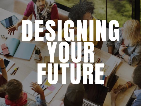 A group collaborating around a table with the text 'Designing Your Future'.