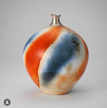 Wild clay terrasigillata with blue/black terrasigillata silver necked vessel 