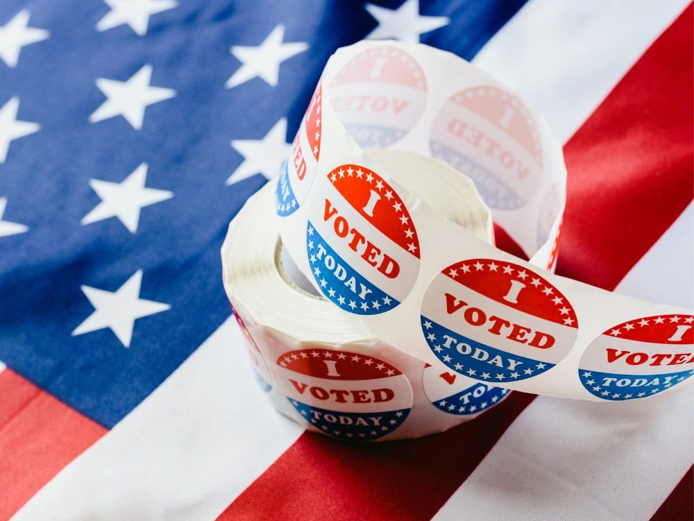 Roll of "I Voted Today" stickers on an American flag.