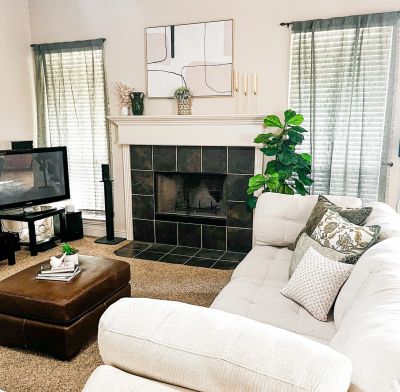 Cozy living room with fireplace and sectional sofa.