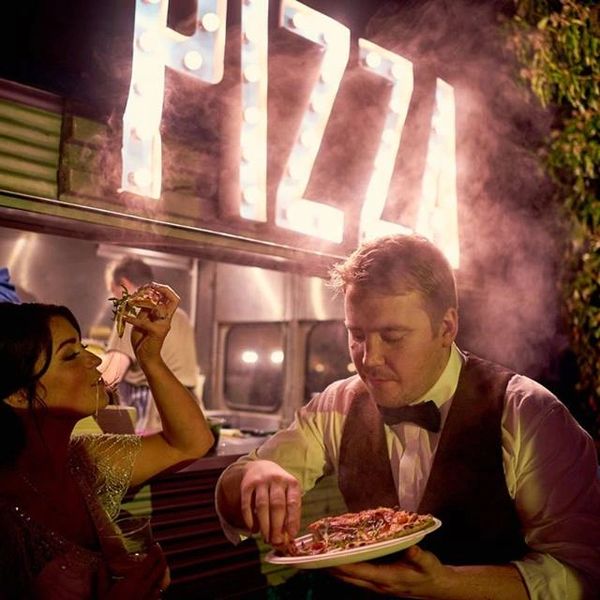 People eating delicious pizza
