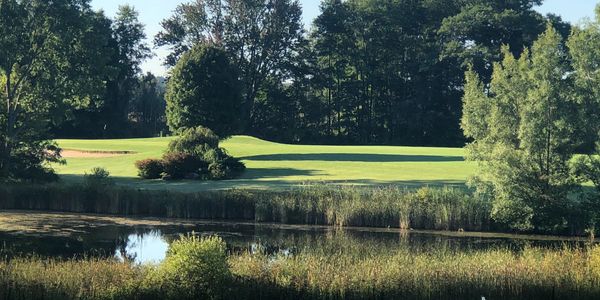 Turtle Lake of Hole #1 is a dogleg left around the pond with a large sand bunker next to the green.