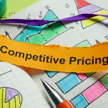 A note with 'Competitive Pricing' on colorful business charts and graphs.