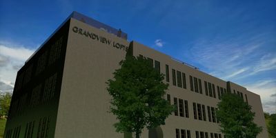 Exterior view of the Grandview Lofts building with trees.