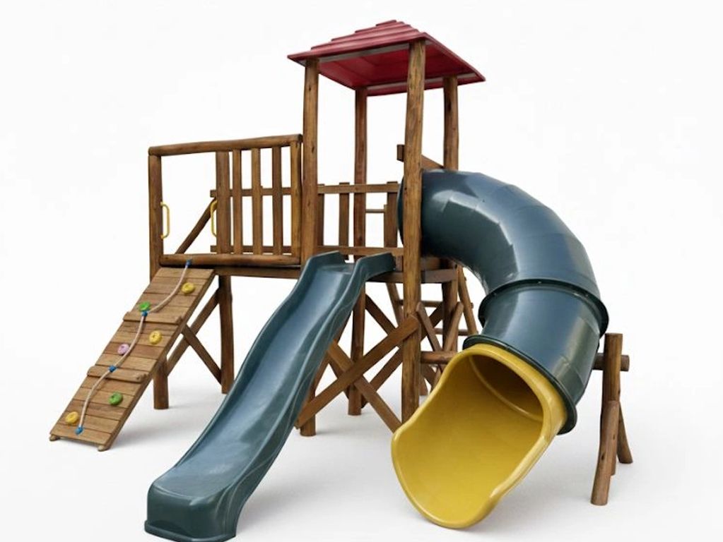 Wooden playground with climbing wall, straight and spiral slides.