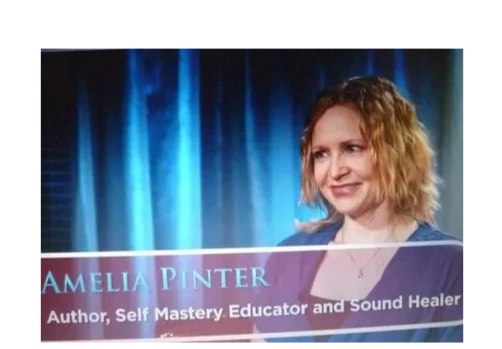 Amelia Pinter, author and sound healer, smiling during an interview.