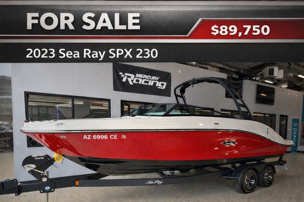 2023 Sea Ray SPX 230 boat for sale at $89,750 in a showroom.