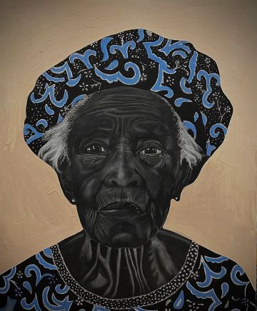Portrait of an elderly woman in blue patterned headscarf and dress.