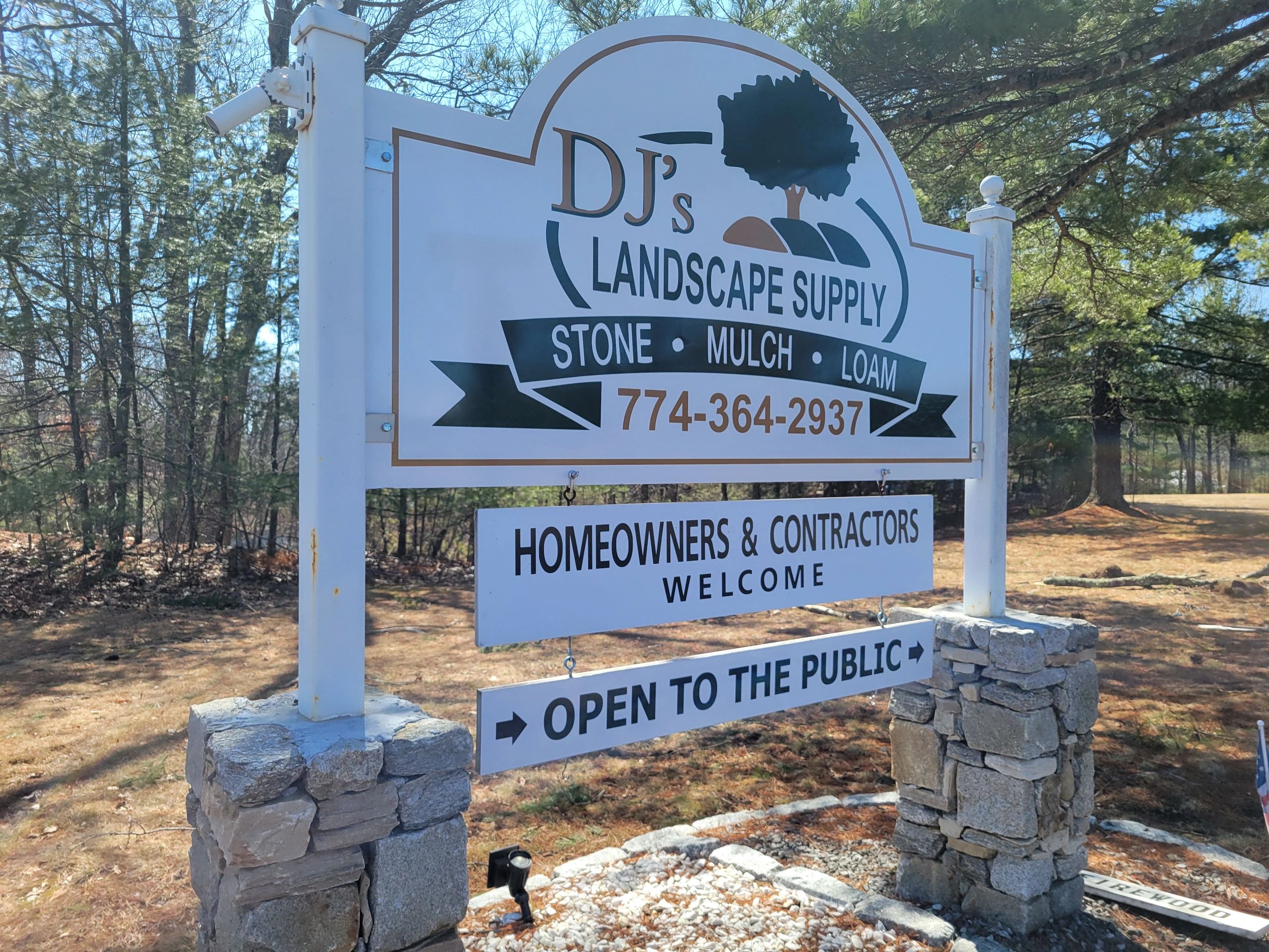 Sign for DJ's Landscape Supply offering stone, mulch, and loam.