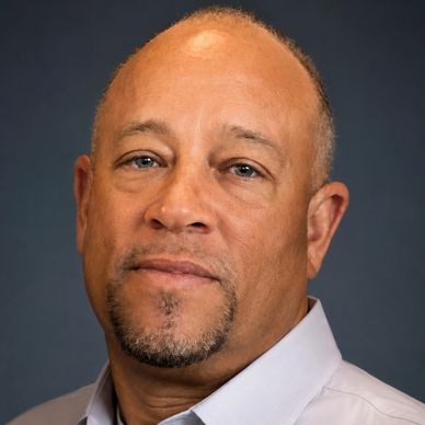 Portrait of a middle-aged man with a goatee.