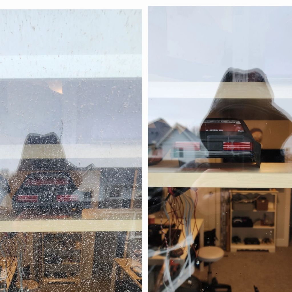 Rain-spattered window with reflections, cleaned and clear despite the weather.