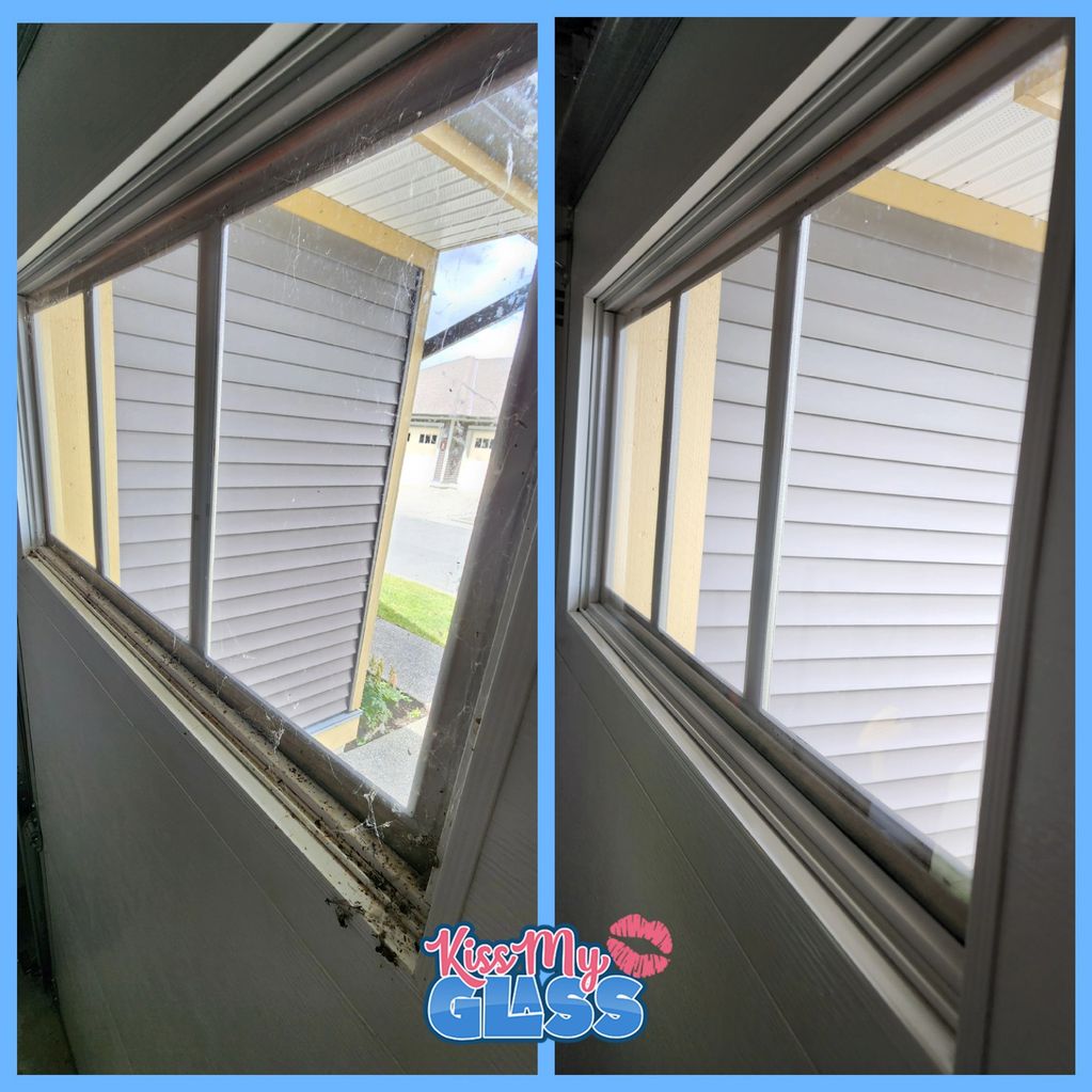 Garage window cleaning removing spider webs and dirt buildup in Chilliwack home.