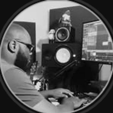 Man working on music production in a studio.