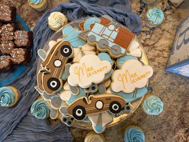 Blue and brown themed cookies with vehicles and "Max Everett" name.