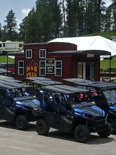 Large group at Mad Peak red caboose. 