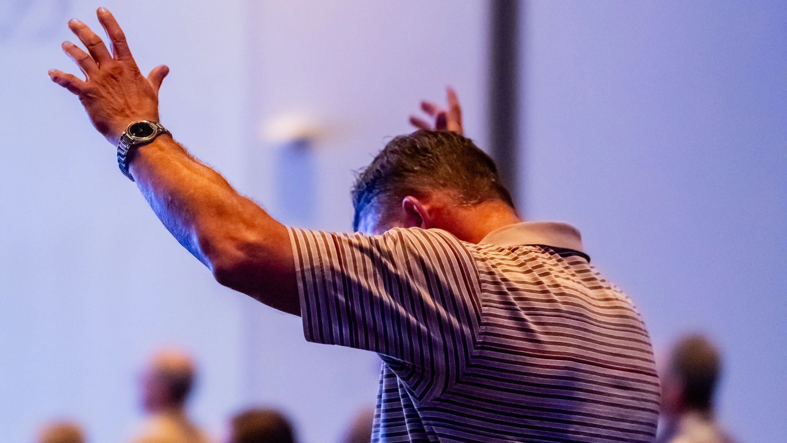 Man raising hands in worship or prayer.