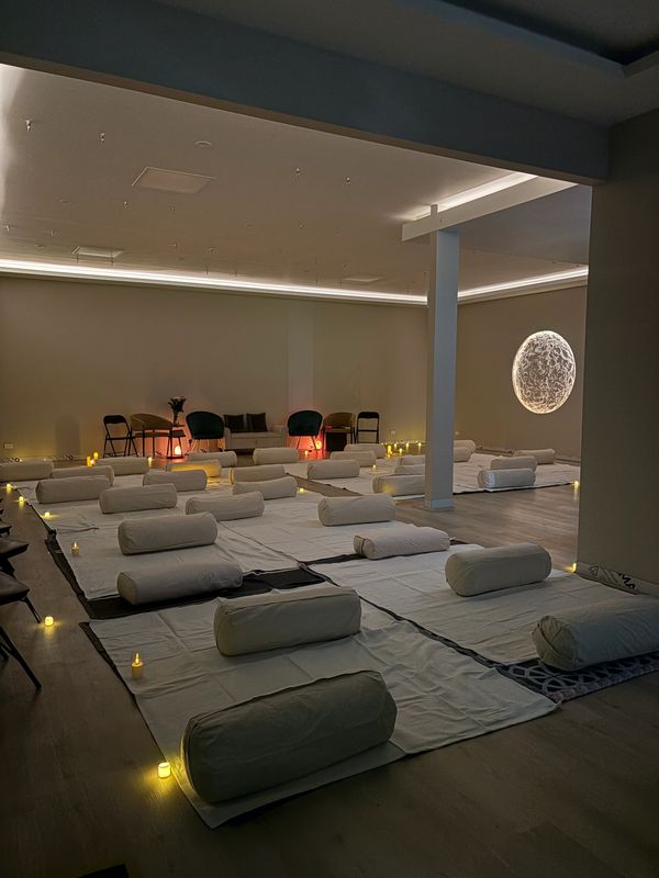 Meditation room with mats and cushions.
