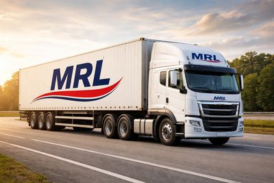 White MRL-branded semi-truck driving on a highway at sunset.