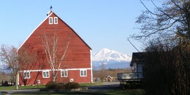 A barn at Hovander Park with a view of Mount baker in the background