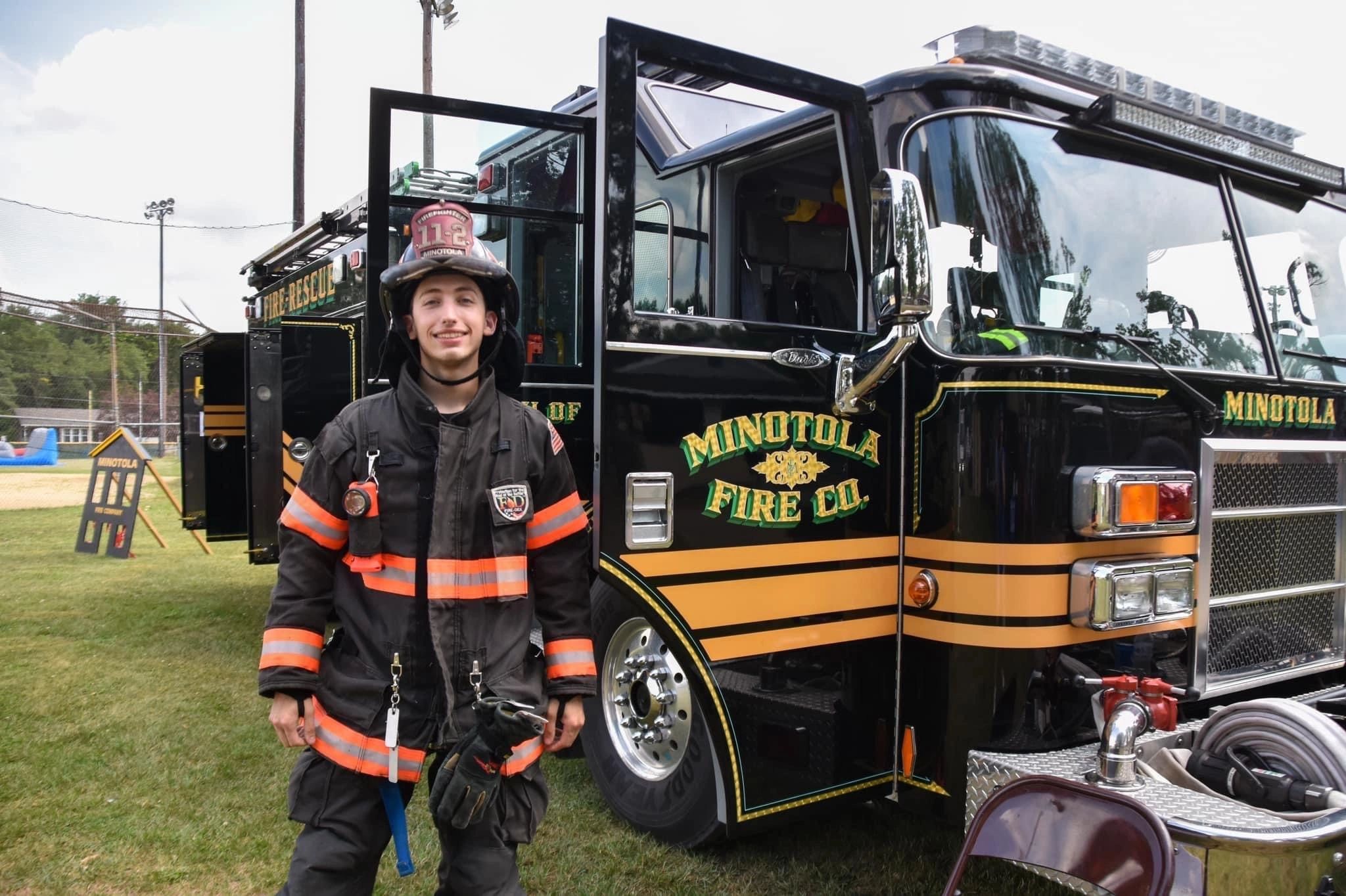 Firefighter with Minotola Fire Company Station 11-2 Rescue Engine 11-22